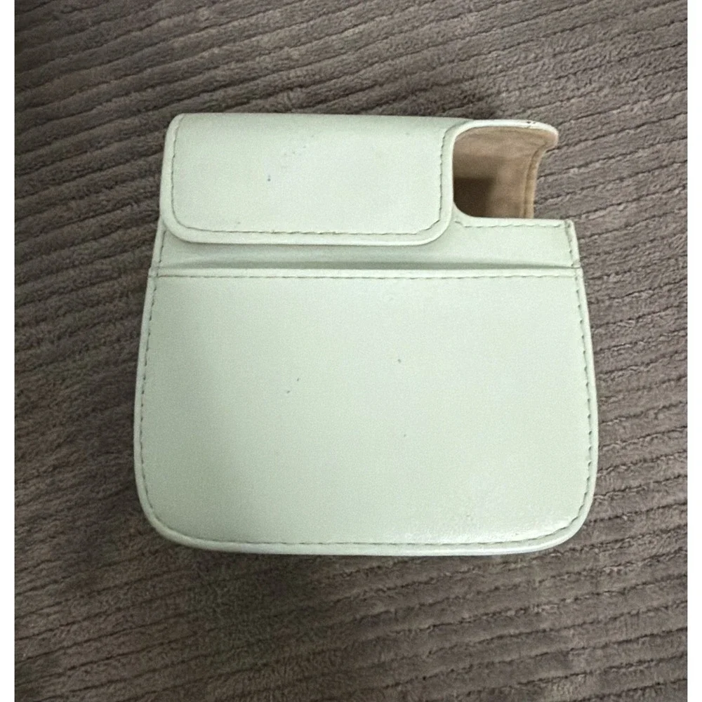 green camera case is designed for Fujifilm Instax Mini cameras